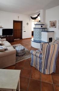 a living room with a couch and a table at Roby53 in Parabiago