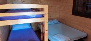 a bedroom with two bunk beds and a bath tub at Camping la Naranja in Gandía +23 photos