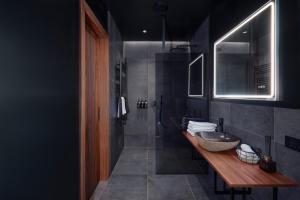 a bathroom with two sinks and a large bowl sink at Tindasel - The Farm in Hella +71 photos