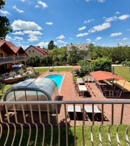 a view of a swimming pool from a balcony at AndreaApartmanok in Balatonfüred