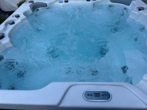 a jacuzzi tub with blue water in it at Montebello in Bellinzona