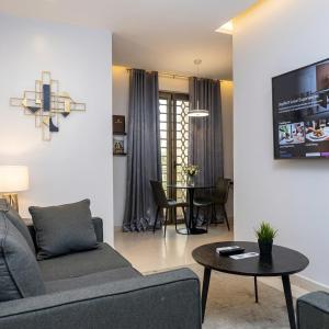 a living room with a couch and a table at Edge ONE Resort in Gwarinpa