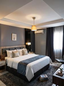 a bedroom with a large bed in a room at Edge ONE Resort in Gwarinpa