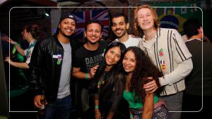 a group of people posing for a picture at a party at Garoa Hostel Party Bar in São Paulo