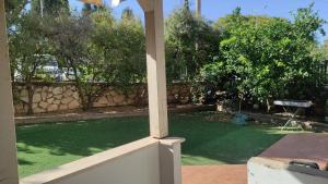 a view of a garden from a porch at בית שבט אחים in Hatzor haglilit