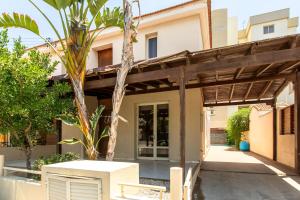 a view of a house with a pergola at Gaia - 4 Bedroom House in Larnaca in Larnaca