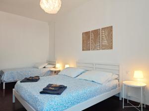 a bedroom with two beds with towels on them at Star Lake in Intra