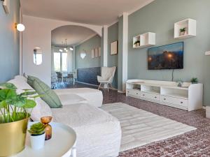 a living room with a white couch and a table at Star Lake in Intra