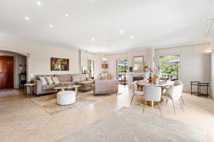 a living room with a couch and a table at Villa Seize St Tropez in Saint-Tropez