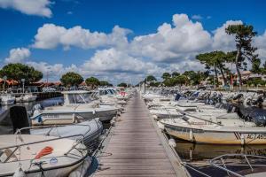 a bunch of boats are docked in a marina at Villa Micoco-Bassin d'Arcachon in Gujan-Mestras