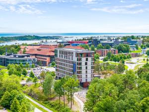 an aerial view of a city with buildings and trees at Comfort Hotel Grimstad in Grimstad