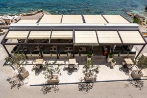 an overhead view of a restaurant with tables and chairs at Heritage Boutique Hotel Adriatic-Adults only in Orebić
