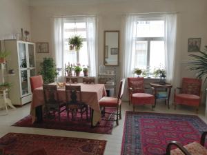 a dining room with a table and chairs at Foggy Island B&B in Kaskö