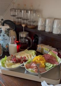 a tray of food on a table with a plate of food at Tant Märtas rum & skafferi in Köinge