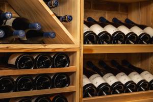 a wine cellar filled with lots of wine bottles at Quinta Amala in Melides