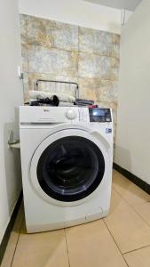 a white washing machine sitting in a room at Ubytko 151 Broumov in Broumov