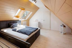 a bedroom with a bed in a attic at Ferienwohnung "Am Waldrand" in Bottrop