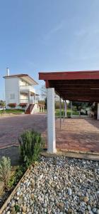 a building with a pavilion and a building with a building at Olive Tree Villa in Preveza