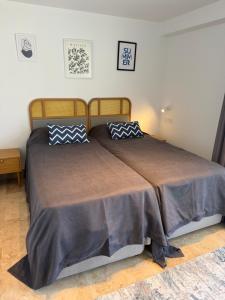 a bedroom with a bed with two pillows on it at Helis Bodrum Residence in Milas +15 photos