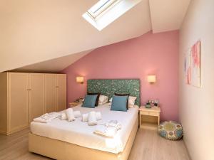 a bedroom with a large bed in a attic at Korina Hotel in Skala Potamias +87 photos
