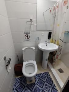 a bathroom with a toilet and a sink at KAMIR Guest House in Bukhara