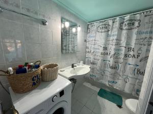 a bathroom with a sink and a shower curtain at Bella's House in Theologos +37 photos