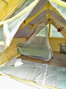 a bedroom with a bed in a tent at Glamping Casacocco' in San Ginesio