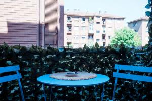 a small blue table with a bowl on top of it at El Prestinée Box auto gratuito in Milan