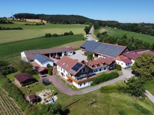an aerial view of a house with solar panels on it at Bauernhof Nißl in Neunburg vorm Wald