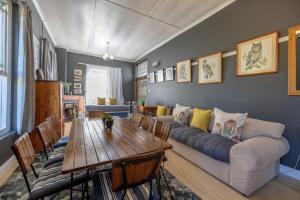 a living room with a couch and a table at 30 on Oatlands Accommodation Makhanda Grahamstown in Grahamstown