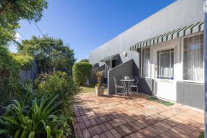 a brick patio in front of a house at 30 on Oatlands Accommodation Makhanda Grahamstown in Grahamstown