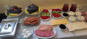 a table topped with bowls of different types of food at Guramishvili 7 in Kobuleti