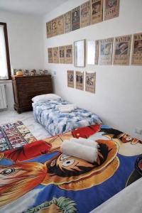 a bedroom with two beds with a disney picture on the wall at Once Upon a Time in Centenaro +38 photos