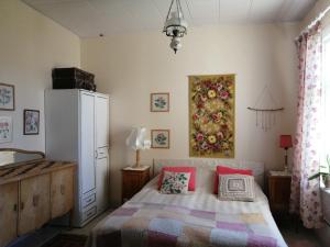 a bedroom with a bed with two pillows on it at Foggy Island B&B in Kaskö