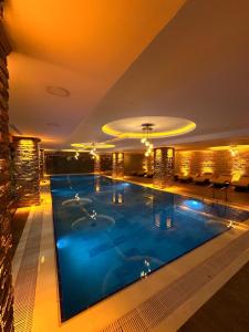 a large swimming pool in a hotel room at Ramada by Wyndham Istanbul Merter in Istanbul