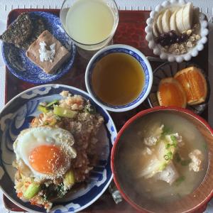 a tray with a bowl of soup and a bowl of food at YAMABE BOSSA inn in Matsumoto
