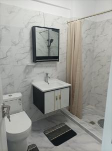a bathroom with a toilet and a sink and a mirror at Stefan - apartament studio in Saturn +29 photos