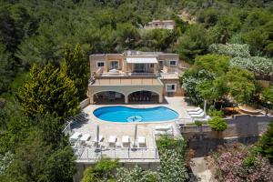 an aerial view of a house with a swimming pool at Ses Casetes Abajo in San Jose