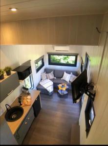 an aerial view of a living room in a tiny house at Tiny House avec jacuzzi privé - calme et nature in Grabels