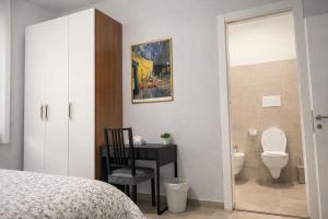 a bedroom with a bed and a bathroom with a toilet at B&B Residence Armonia Sulmona in Sulmona +45 photos