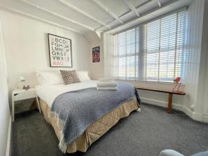 a bedroom with a large bed and a window at MHOR 84 in Kingshouse
