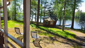 a view from the porch of a house with a duck house at Koivurannan Lomamökit Paju in Mikkeli