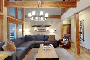a living room with a blue couch and a table at Stone Mountain Vista in McHenry +136 photos