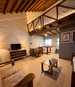 a living room with a couch and a table at BanTelmo in Juana Koslay 