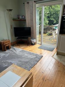 a living room with a large sliding glass door at Reads Park No 2 in Galbally