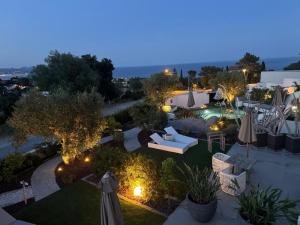 an aerial view of a garden at night at Appartements vue mer Rêves d'Azur Les Issambres in Les Issambres