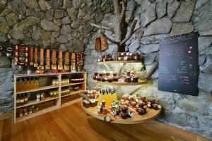 a tasting room with bottles of wine on display at Birkenhof in Sluderno +17 photos