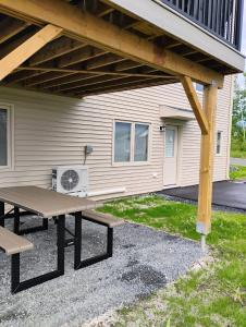 a picnic table in front of a house at Apartment in Fredericton in Fredericton