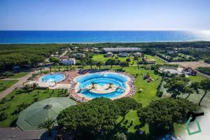 an aerial view of a resort with two pools at Hotiday Montalto Marina in Torre di Montalto