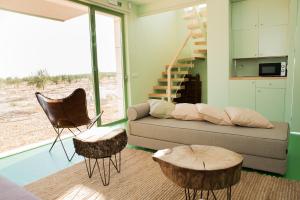a living room with a couch and two tables at Luz de Alba in Argamasilla de Alba